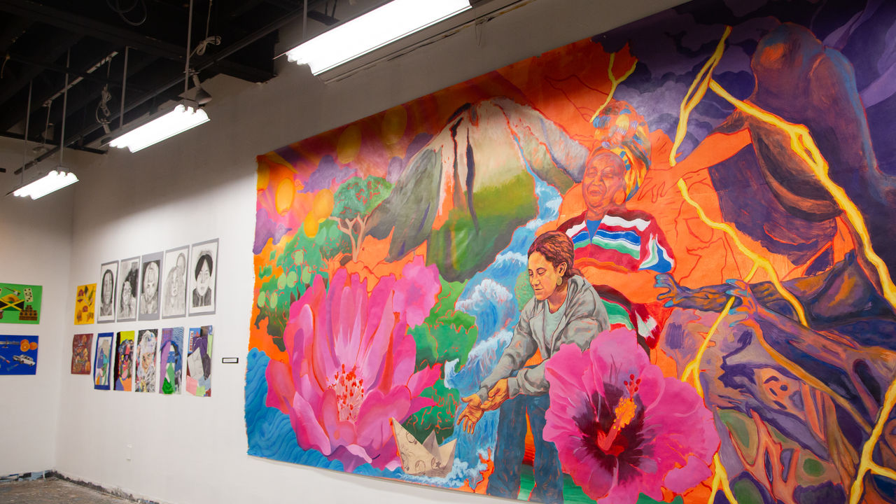 Image of mural and artwork on wall. 