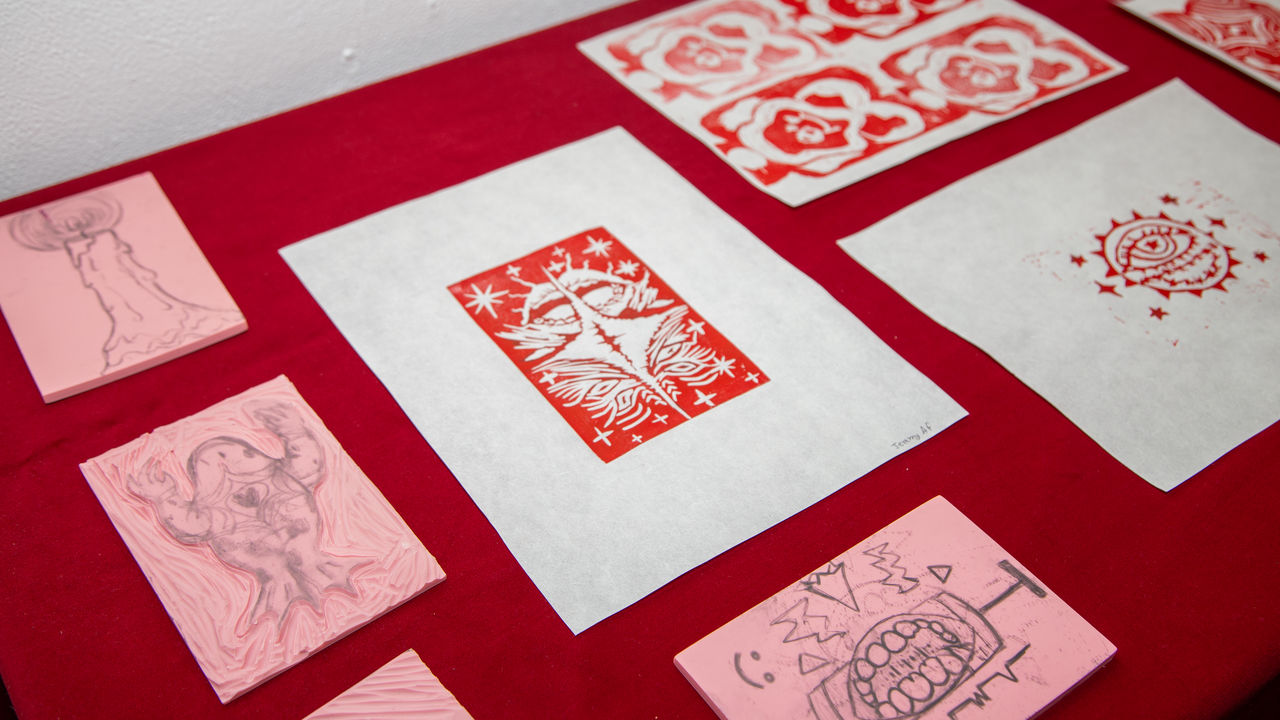 Various prints displayed on table 