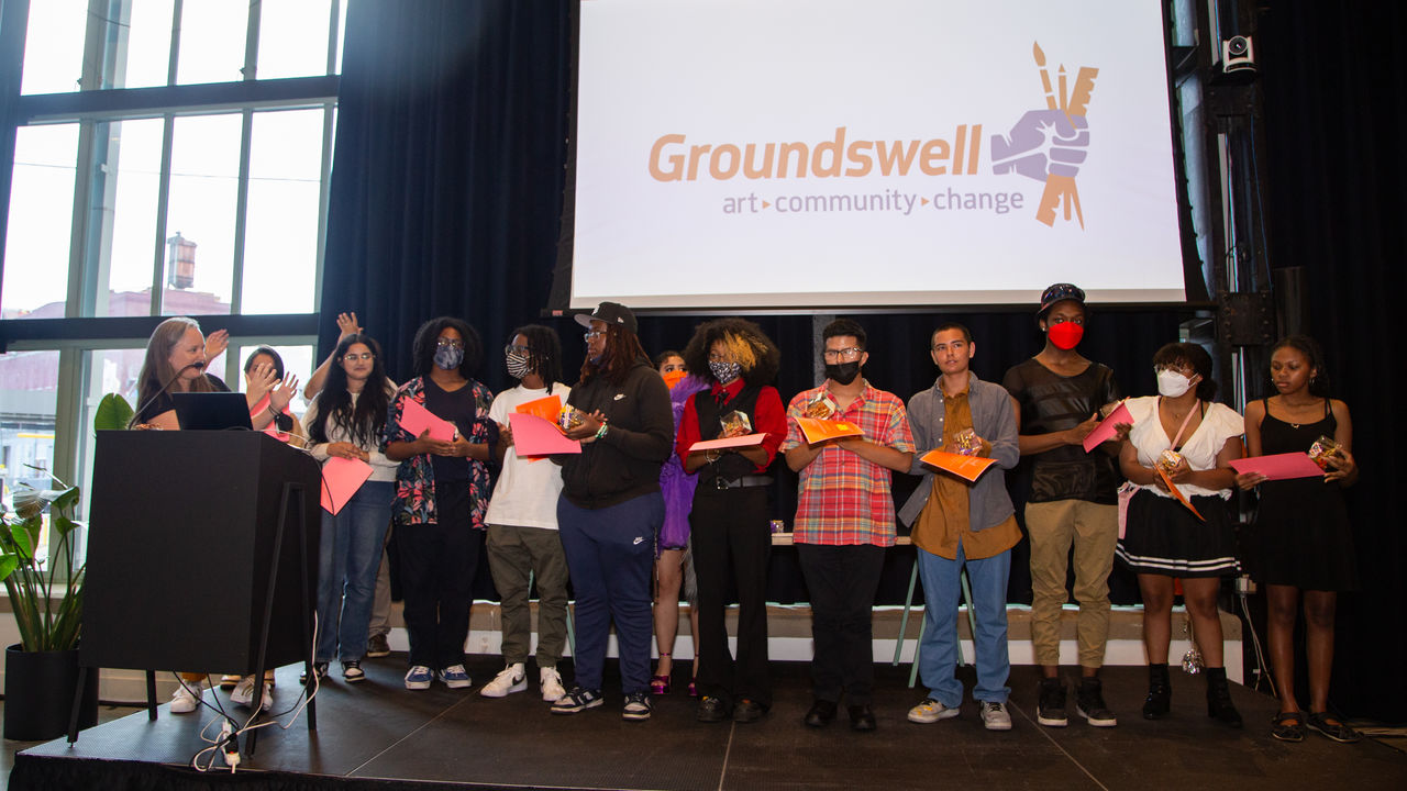 Group of students receiving awards on stage 