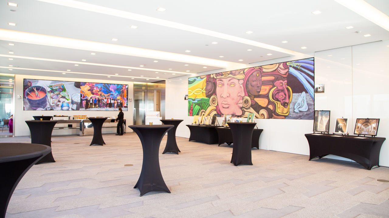 Wide image of room with artwork and tables