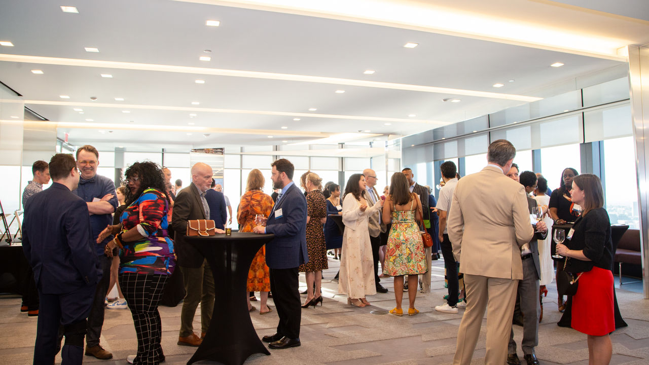 Room full of people conversing 