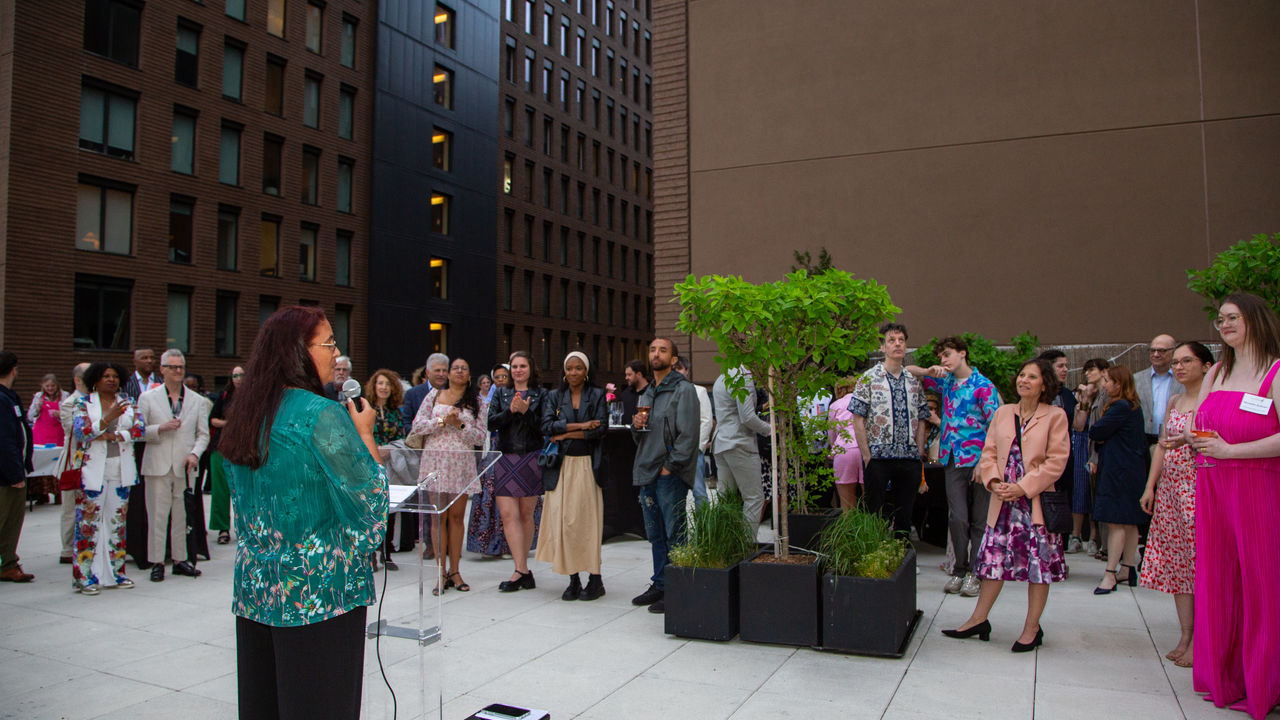 Group of people listening to presenter speak