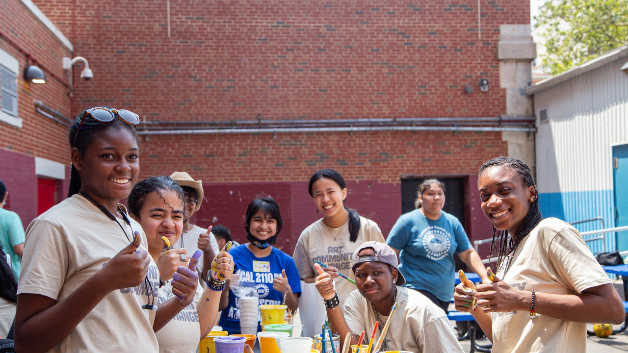Group photo of students at a paint day 