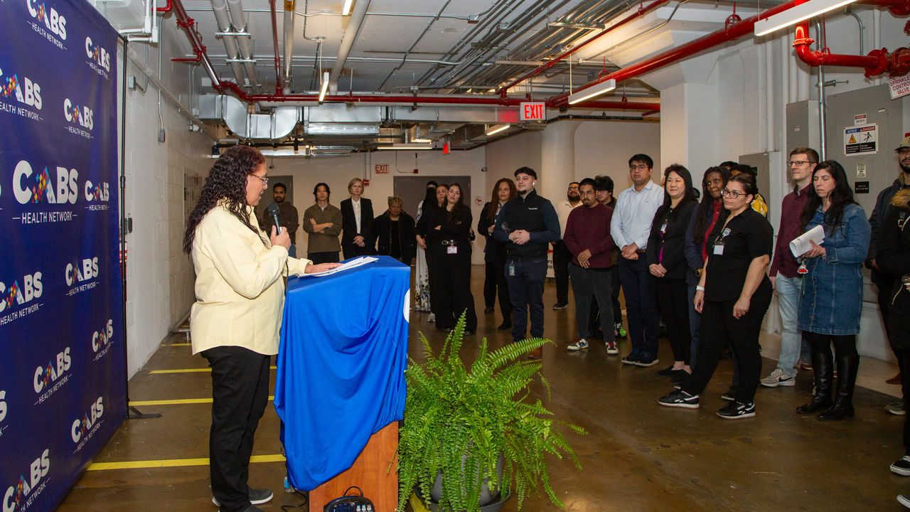 People watching a presenter speak 