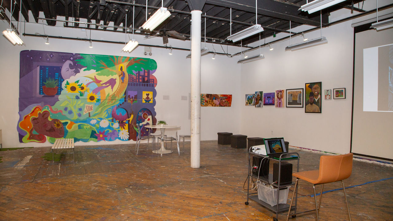 Photo of Groundswell studio with various art on the wall