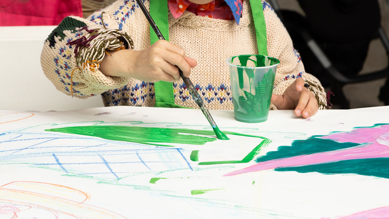 Child painting a canvas