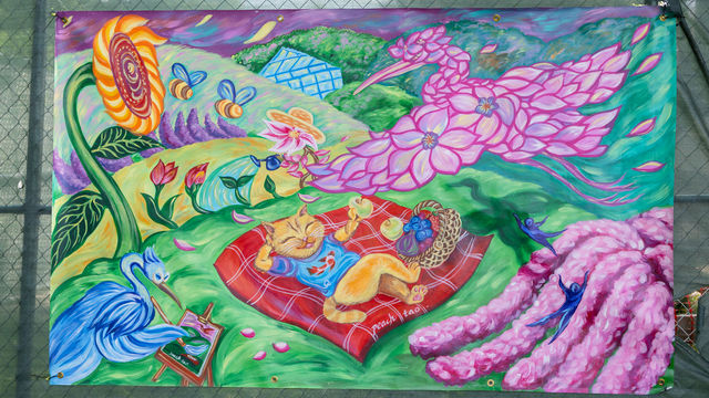 Mural with natural elements, like birds, flowers, a cat