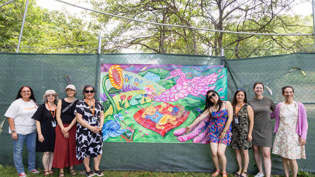 Group photos in front of finished mural