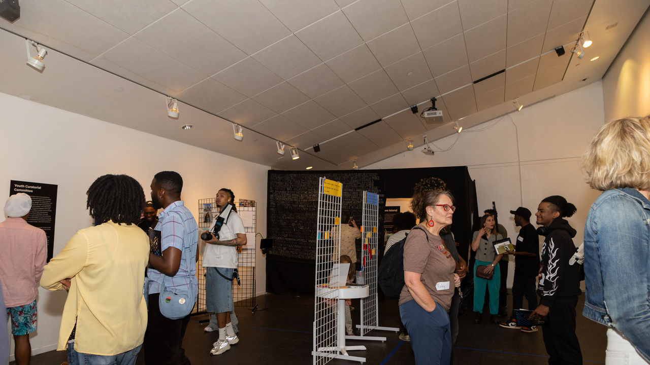 People looking at art in exhibition space 
